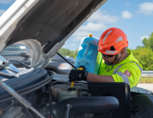 Road Ranger putting water in a vehicle